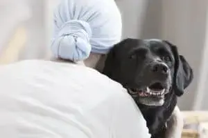 dog hugging patient